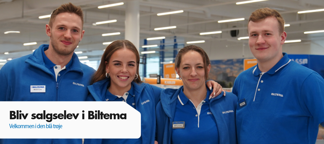 Fire Biltema-medarbejdere og elever i blå uniformer smiler til kameraet.