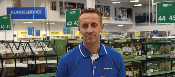 Biltema employee standing in front of the Leisure Department