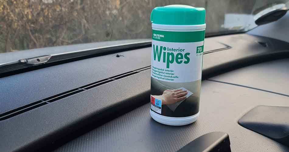 Interior wipes for cleaning the inside of the car, placed on the dashboard.